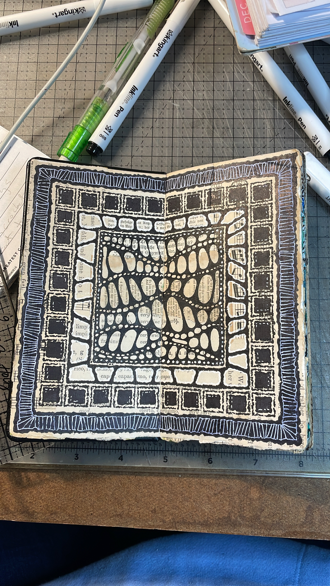 Detailed black and white art journal spread