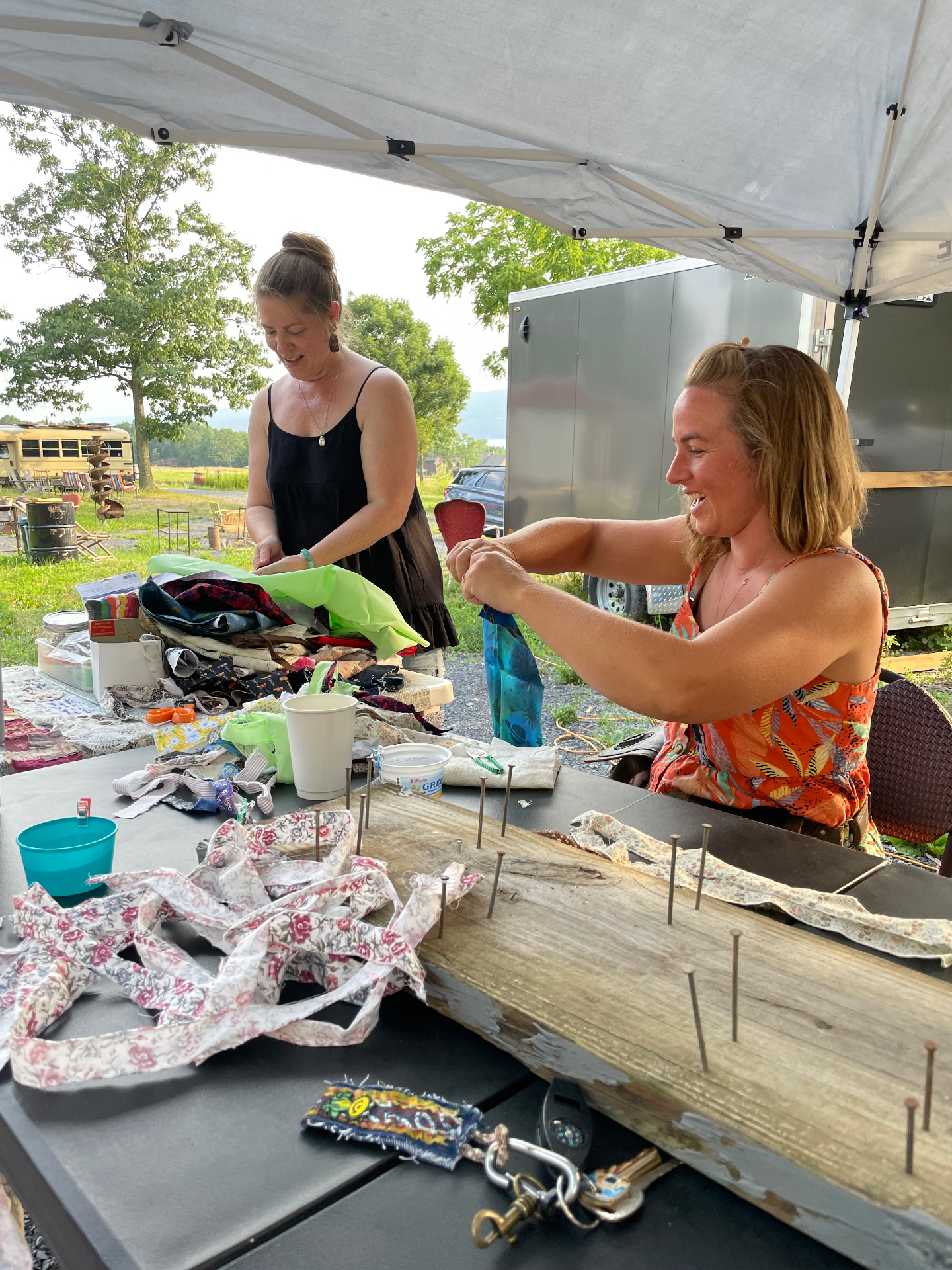 Creating fabric art together outdoors