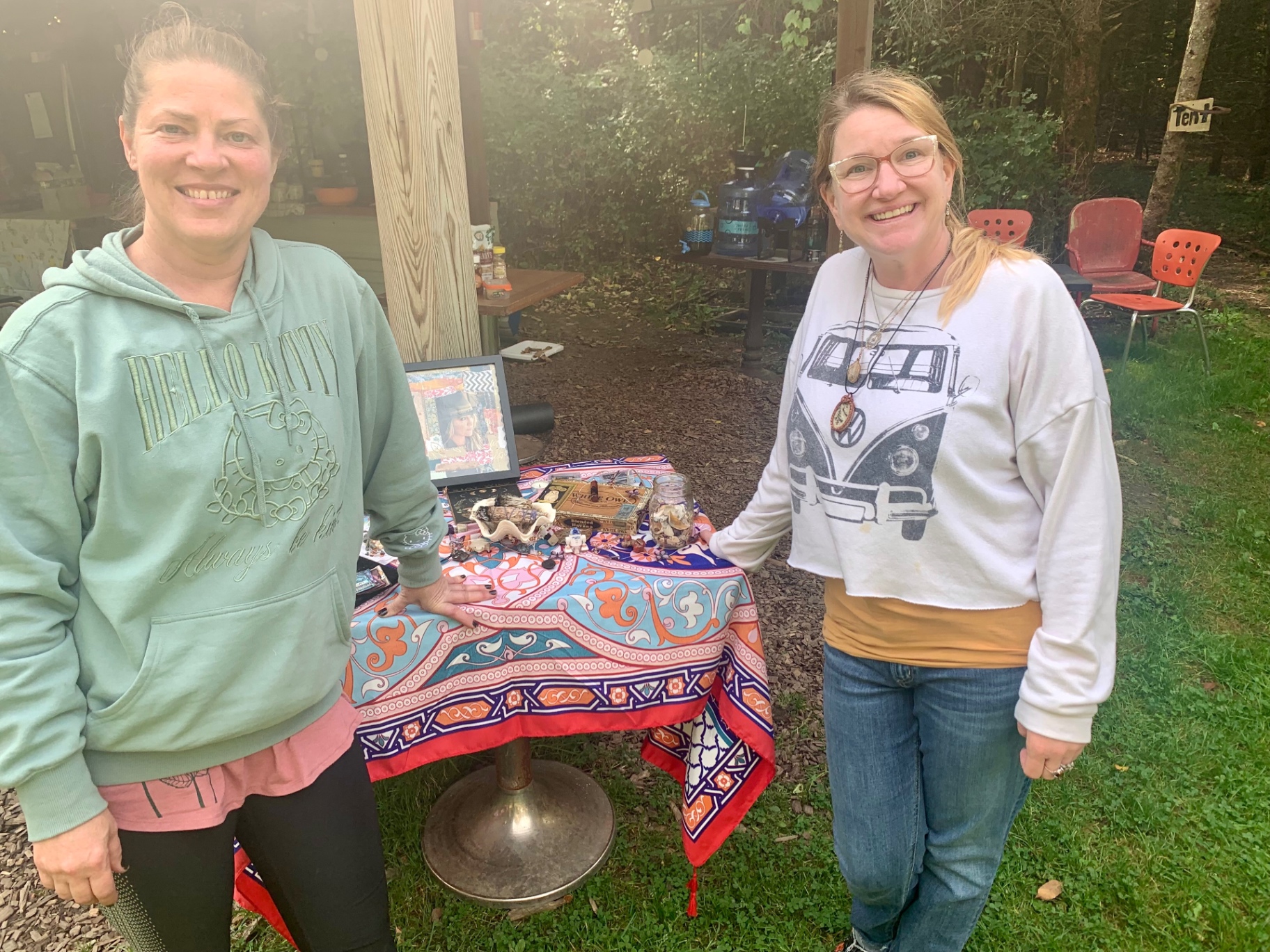 Stephanie and Tera at an outdoor retreat table